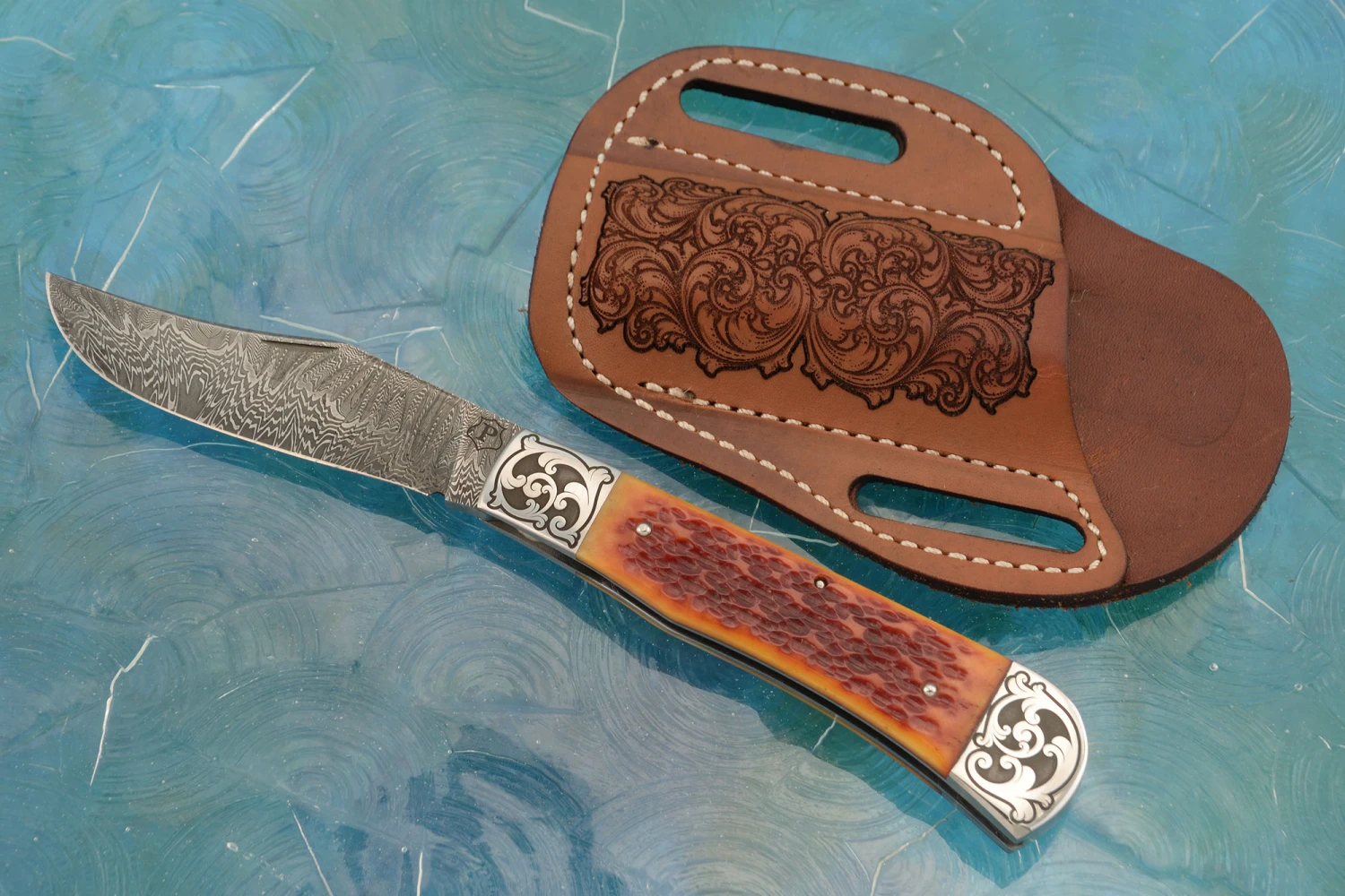 Damascus Slipjoint Trapper With Amber Jigged Bone 1 Damascus Slipjoint Trapper With Amber Jigged Bone