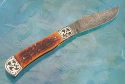 Damascus Slipjoint Trapper With Amber Jigged Bone 13 Damascus Slipjoint Trapper With Amber Jigged Bone -Optimal Knives Store 105853 7 x